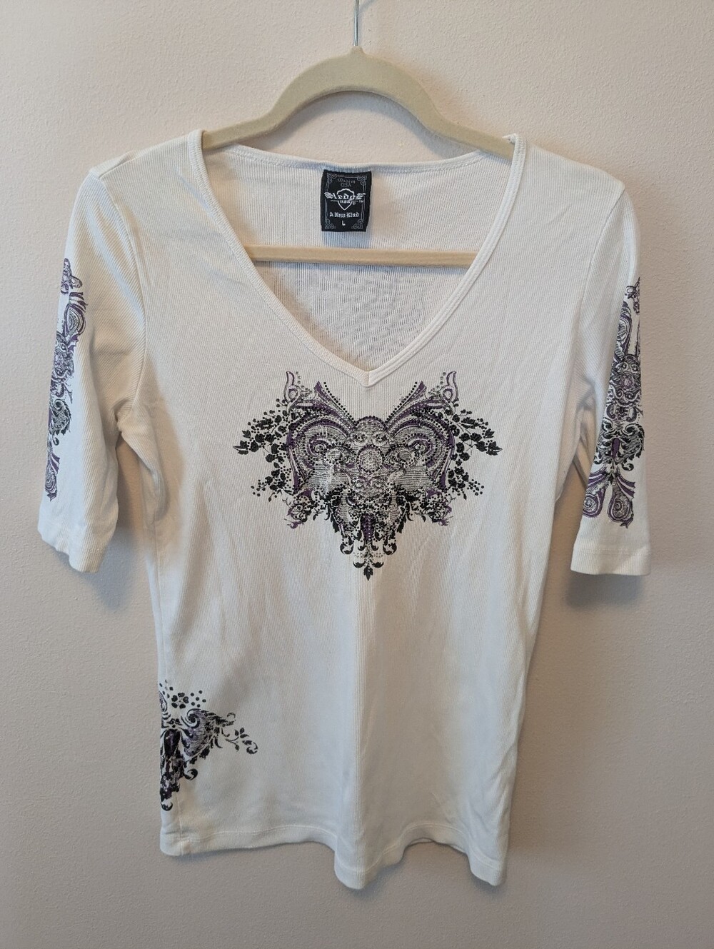 A. Byer White V-Neck Tee with Purple and Black Heart Motif